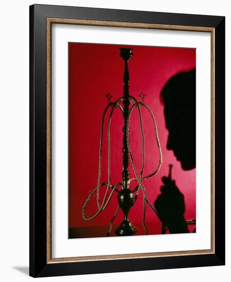 Silhouetted Man Smoking Cannabis From a Pipe-Tek Image-Framed Photographic Print