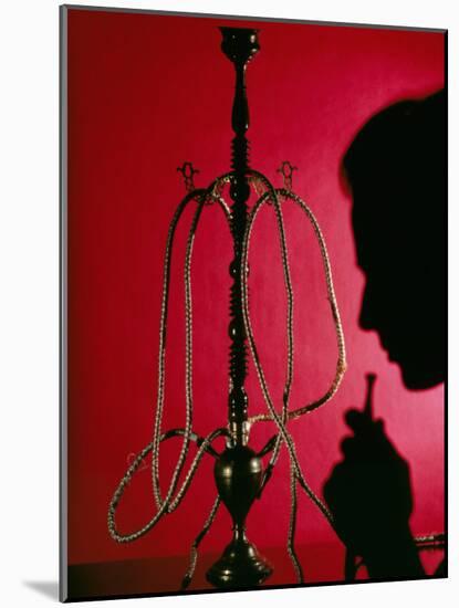 Silhouetted Man Smoking Cannabis From a Pipe-Tek Image-Mounted Photographic Print