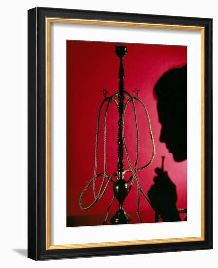 Silhouetted Man Smoking Cannabis From a Pipe-Tek Image-Framed Photographic Print