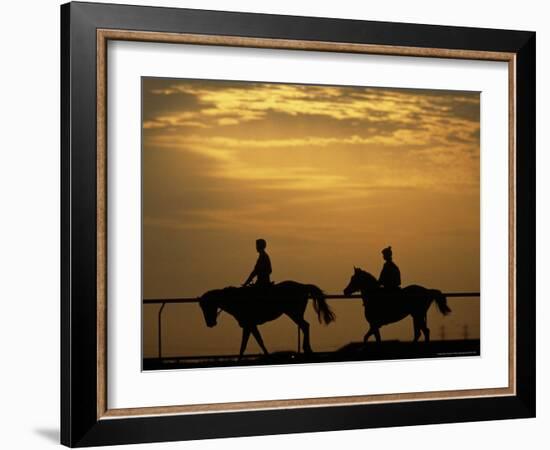 Silhouetted Men Riding on Horses, Dubai, UAE-Henry Horenstein-Framed Photographic Print