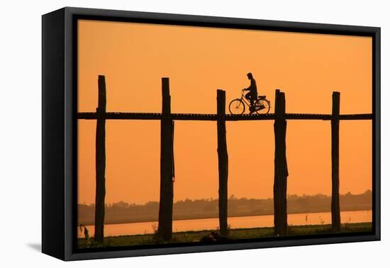 Silhouetted Person with a Bike on U Bein Bridge at Sunset, Amarapura, Mandalay Region, Myanmar-Don Mammoser-Framed Premier Image Canvas