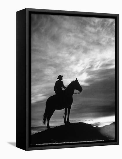 Silhouettes of Cowboy Mounted on Horse-Allan Grant-Framed Premier Image Canvas