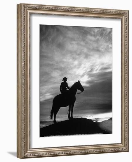 Silhouettes of Cowboy Mounted on Horse-Allan Grant-Framed Photographic Print