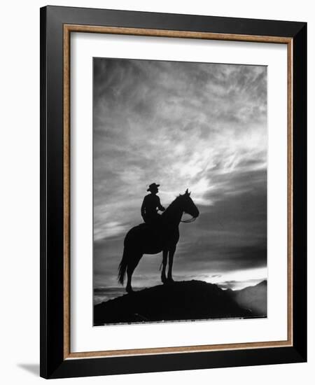 Silhouettes of Cowboy Mounted on Horse-Allan Grant-Framed Photographic Print