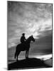 Silhouettes of Cowboy Mounted on Horse-Allan Grant-Mounted Photographic Print