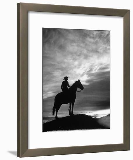 Silhouettes of Cowboy Mounted on Horse-Allan Grant-Framed Photographic Print