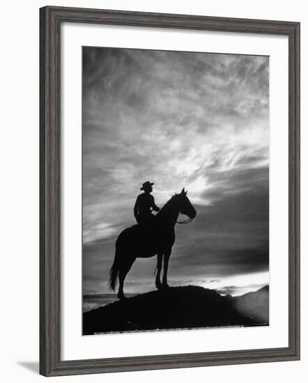 Silhouettes of Cowboy Mounted on Horse-Allan Grant-Framed Photographic Print