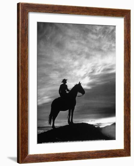 Silhouettes of Cowboy Mounted on Horse-Allan Grant-Framed Photographic Print