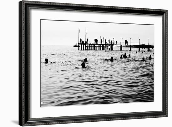 Silhouettes of Having a Rest People. it is Black a White Photo of a Sea Pier and Having a Rest Peop-Mikhail hoboton Popov-Framed Photographic Print