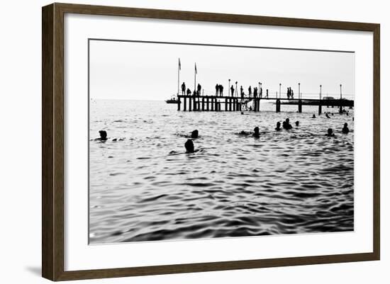 Silhouettes of Having a Rest People. it is Black a White Photo of a Sea Pier and Having a Rest Peop-Mikhail hoboton Popov-Framed Photographic Print