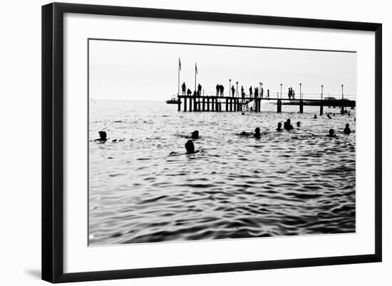 Silhouettes of Having a Rest People. it is Black a White Photo of a Sea Pier and Having a Rest Peop-Mikhail hoboton Popov-Framed Photographic Print