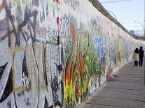 Couple Walking Along the East Side Gallery Berlin Wall Mural, Berlin, Germany, Europe-Simon Montgomery-Photographic Print