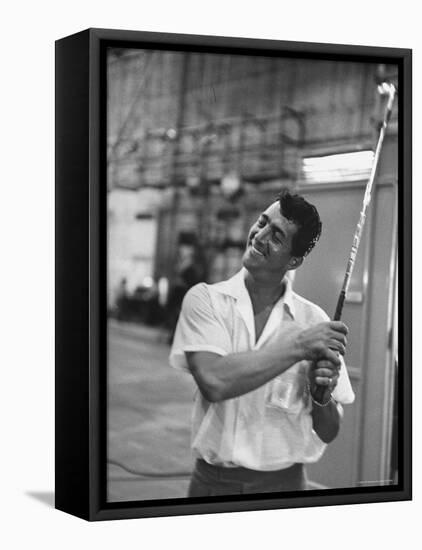 Singer and Actor Dean Martin holding a pitching club on Movie Set for MGM's "Some Came Running"-Allan Grant-Framed Premier Image Canvas