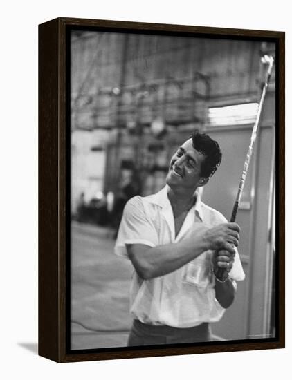 Singer and Actor Dean Martin holding a pitching club on Movie Set for MGM's "Some Came Running"-Allan Grant-Framed Premier Image Canvas