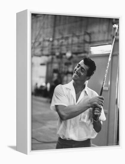 Singer and Actor Dean Martin holding a pitching club on Movie Set for MGM's "Some Came Running"-Allan Grant-Framed Premier Image Canvas