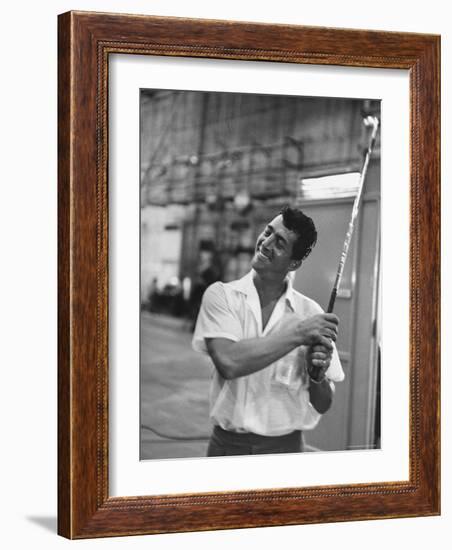 Singer and Actor Dean Martin holding a pitching club on Movie Set for MGM's "Some Came Running"-Allan Grant-Framed Premium Photographic Print