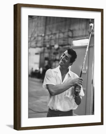 Singer and Actor Dean Martin holding a pitching club on Movie Set for MGM's "Some Came Running"-Allan Grant-Framed Premium Photographic Print