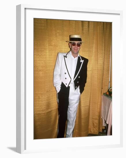 Singer and Songwriter Elton John in Black and White Tuxedo, Wearing Sunglasses-David Mcgough-Framed Premium Photographic Print