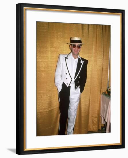 Singer and Songwriter Elton John in Black and White Tuxedo, Wearing Sunglasses-David Mcgough-Framed Premium Photographic Print