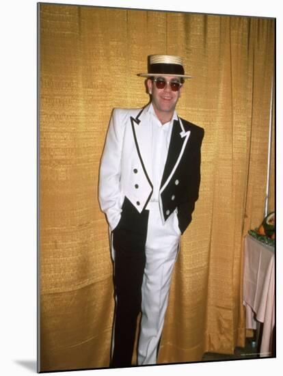 Singer and Songwriter Elton John in Black and White Tuxedo, Wearing Sunglasses-David Mcgough-Mounted Premium Photographic Print