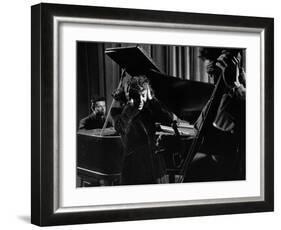 Singer Edith Piaf Holding Her Hands to Her Head While Performing with Pianist and Bass Player-Gjon Mili-Framed Premium Photographic Print