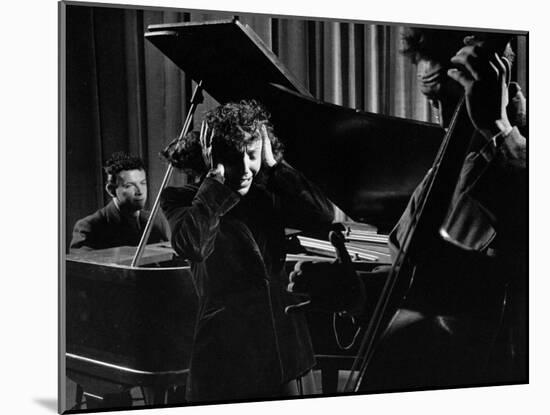 Singer Edith Piaf Holding Her Hands to Her Head While Performing with Pianist and Bass Player-Gjon Mili-Mounted Premium Photographic Print