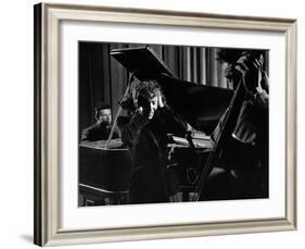 Singer Edith Piaf Holding Her Hands to Her Head While Performing with Pianist and Bass Player-Gjon Mili-Framed Premium Photographic Print