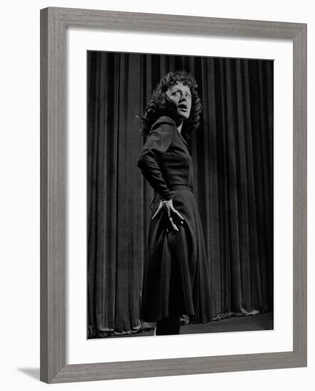 Singer Edith Piaf with Hands on Hips, Standing on Stage-Gjon Mili-Framed Premium Photographic Print