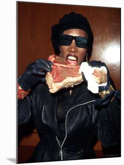 Singer Grace Jones Putting Raw Steak to Mouth-Marion Curtis-Mounted Premium Photographic Print