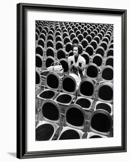 Singer Jane Froman Knitting in Empty Studio Audience Chairs During a Radio Broadcast Rehearsal-Alfred Eisenstaedt-Framed Premium Photographic Print