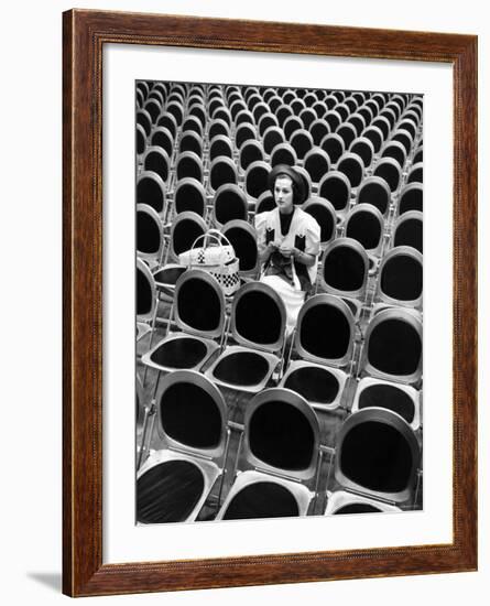 Singer Jane Froman Knitting in Empty Studio Audience Chairs During a Radio Broadcast Rehearsal-Alfred Eisenstaedt-Framed Premium Photographic Print