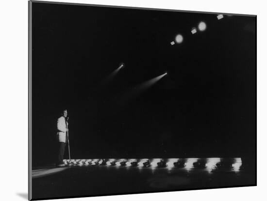 Singer Pat Boone Singing into Mike in Front of the Footlights on Stage in Auditorium-null-Mounted Photographic Print