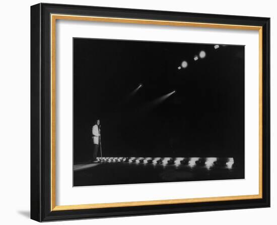 Singer Pat Boone Singing into Mike in Front of the Footlights on Stage in Auditorium-null-Framed Photographic Print