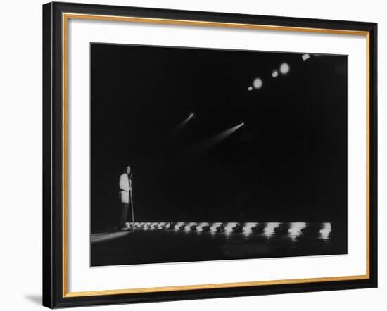 Singer Pat Boone Singing into Mike in Front of the Footlights on Stage in Auditorium-null-Framed Photographic Print