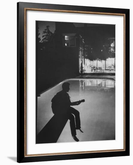 Singer Ricky Nelson Playing Guitar on Poolside-Ralph Crane-Framed Premium Photographic Print