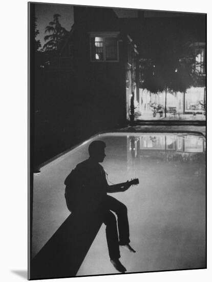 Singer Ricky Nelson Playing Guitar on Poolside-Ralph Crane-Mounted Premium Photographic Print