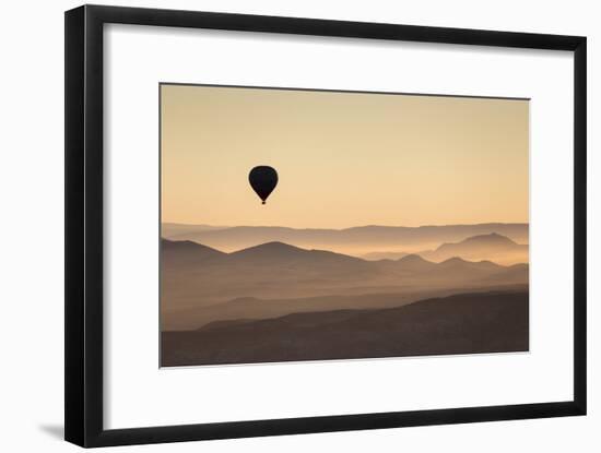 Single Hot Air Balloon over a Misty Dawn Sky, Cappadocia, Anatolia, Turkey, Asia Minor, Eurasia-David Clapp-Framed Photographic Print