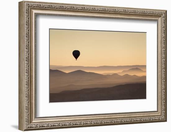 Single Hot Air Balloon over a Misty Dawn Sky, Cappadocia, Anatolia, Turkey, Asia Minor, Eurasia-David Clapp-Framed Photographic Print