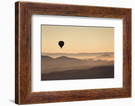 Single Hot Air Balloon over a Misty Dawn Sky, Cappadocia, Anatolia, Turkey, Asia Minor, Eurasia-David Clapp-Framed Photographic Print