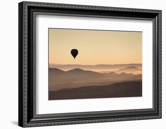 Single Hot Air Balloon over a Misty Dawn Sky, Cappadocia, Anatolia, Turkey, Asia Minor, Eurasia-David Clapp-Framed Photographic Print