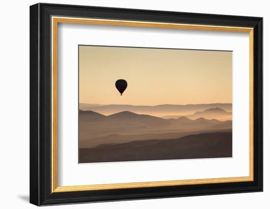 Single Hot Air Balloon over a Misty Dawn Sky, Cappadocia, Anatolia, Turkey, Asia Minor, Eurasia-David Clapp-Framed Photographic Print