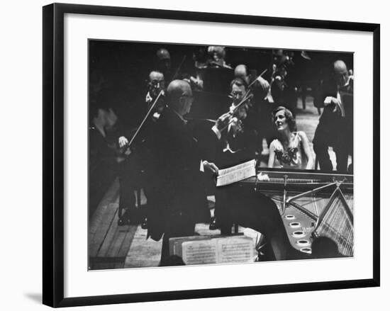 Sir Thomas Beecham Conducting Orchestra as Lady Beecham Plays Piano-Michael Rougier-Framed Premium Photographic Print