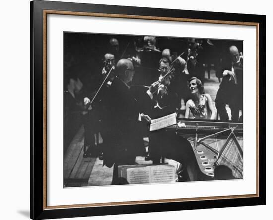 Sir Thomas Beecham Conducting Orchestra as Lady Beecham Plays Piano-Michael Rougier-Framed Premium Photographic Print