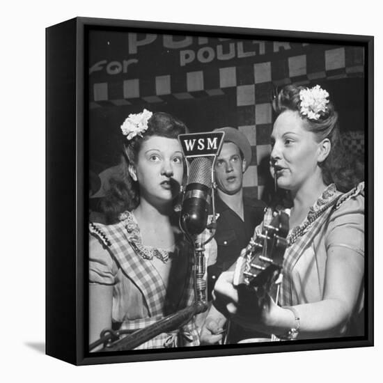 Sisters Performing at the Microphone at the Grand Ole Opry-Ed Clark-Framed Premier Image Canvas