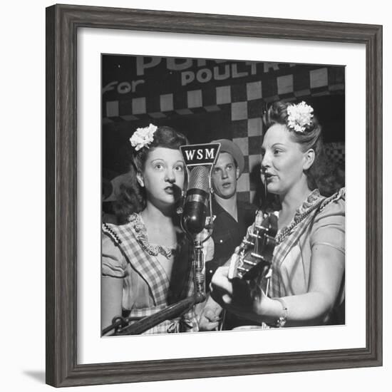 Sisters Performing at the Microphone at the Grand Ole Opry-Ed Clark-Framed Photographic Print