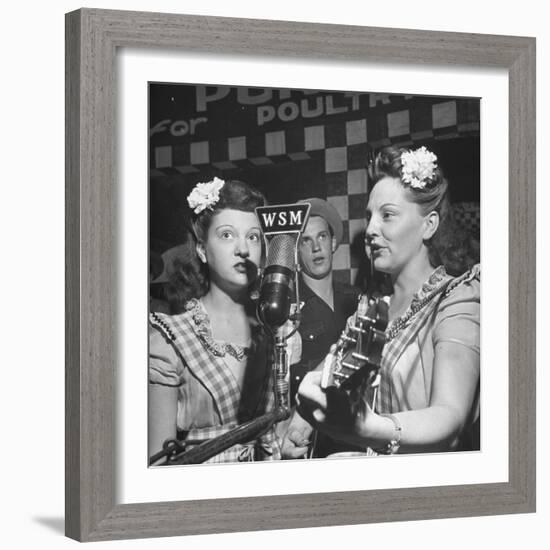 Sisters Performing at the Microphone at the Grand Ole Opry-Ed Clark-Framed Photographic Print