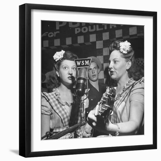 Sisters Performing at the Microphone at the Grand Ole Opry-Ed Clark-Framed Photographic Print