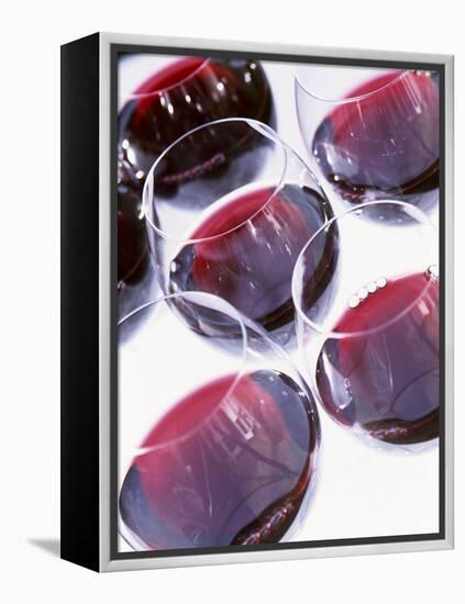 Six Glasses of Red Wine Against White Background-Linda Burgess-Framed Premier Image Canvas