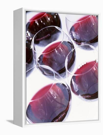 Six Glasses of Red Wine Against White Background-Linda Burgess-Framed Premier Image Canvas