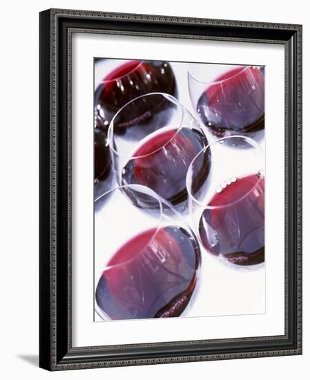 Six Glasses of Red Wine Against White Background-Linda Burgess-Framed Photographic Print